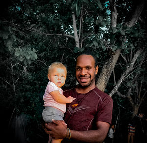 A man holding a baby