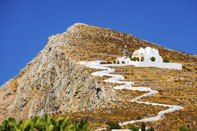 Low angle view of castle against clear blue sky