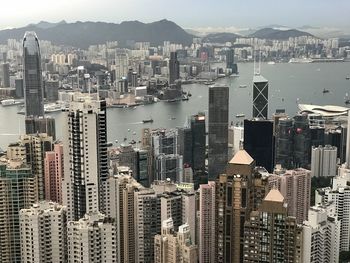 High angle view of modern buildings in city against sky