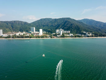 Scenic view of bay against clear sky