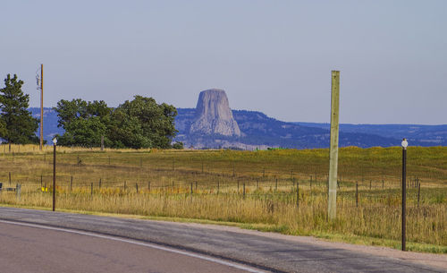 Road by landscape against sky