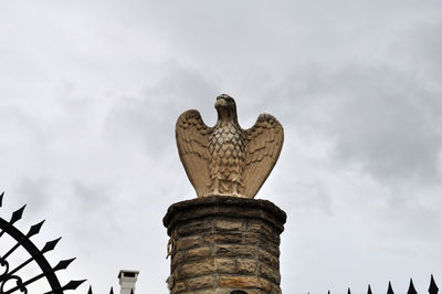 Low angle view of statue against sky