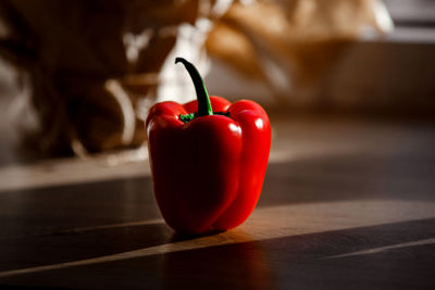 Close-up of red bell peppers on table