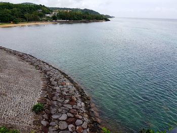 High angle view of sea shore against sky