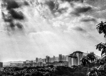 View of buildings against cloudy sky