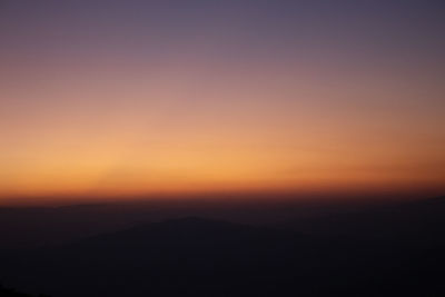 Scenic view of silhouette landscape against romantic sky at sunset