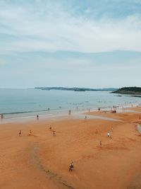 High angle view of people on beach against sky