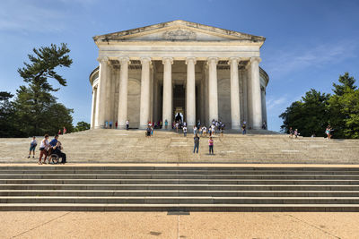 People in front of historical building