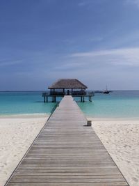 Pier over sea against sky