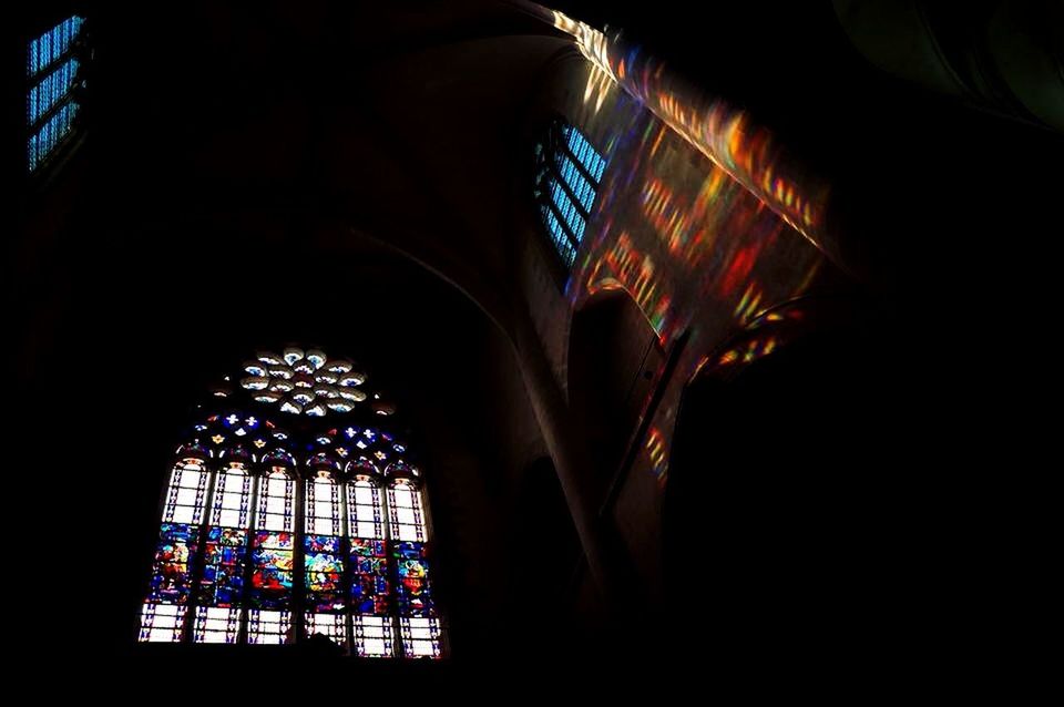 architecture, window, indoors, built structure, illuminated, low angle view, stained glass, place of worship, religion, night, glass - material, church, building exterior, spirituality, decoration, lighting equipment, no people, pattern, design