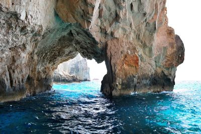 Natural arch of cliff in sea