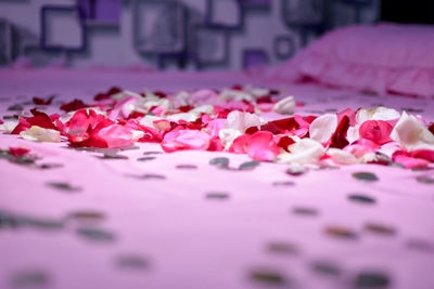 Rose petals on bed at home