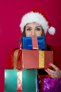 Portrait of young woman holding gift