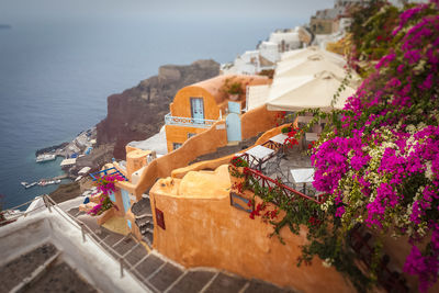 High angle view of buildings by sea