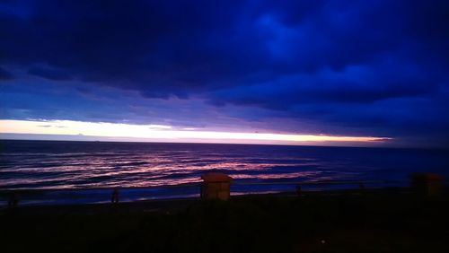 Scenic view of sea against sky at sunset