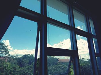 Low angle view of glass window of house