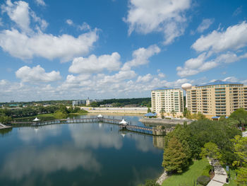 High angle view of river and buildings against sky