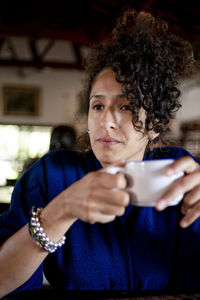 Relaxed woman drinking a cup of coffee,