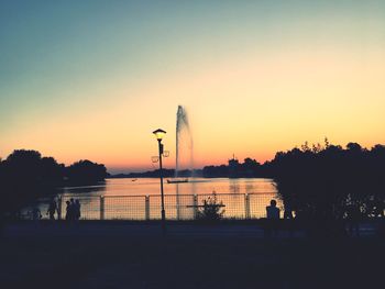 Scenic view of lake against orange sky