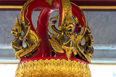 Close-up of garuda sculptures in temple