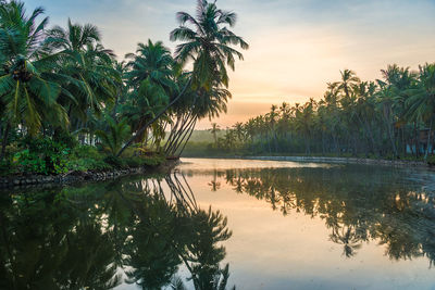 Scenic view of lake against sky at sunset