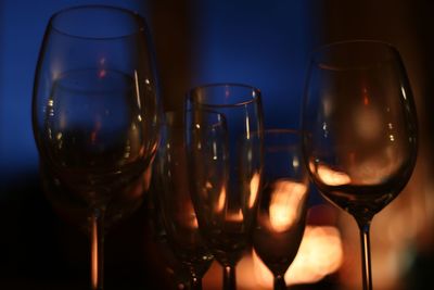 Close-up of wine glasses on table