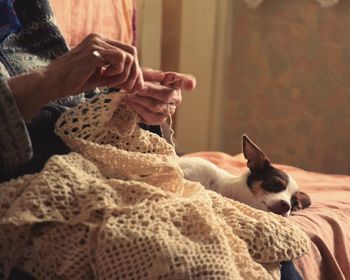 Close-up of woman sitting at home