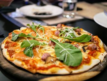 Close-up of pizza served in plate on table