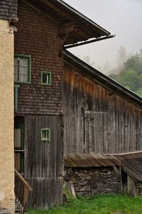 Exterior of abandoned house against sky