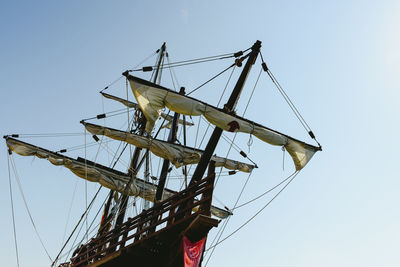 Low angle view of sailboat against clear sky