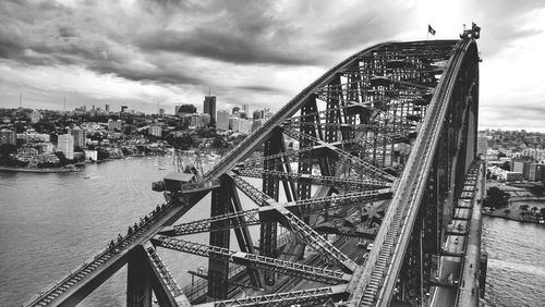 High angle view of sydney harbor bridge over river against cloudy sky