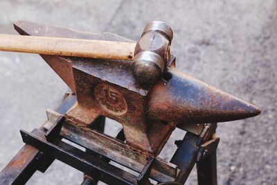 High angle view of hammer on anvil