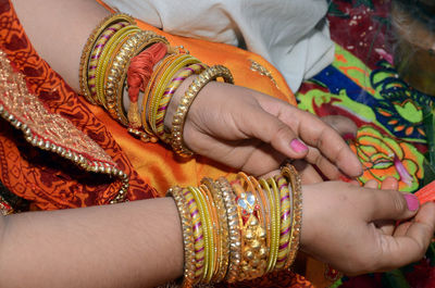 Midsection of woman with tattoo