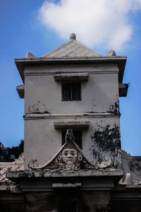 Low angle view of old building against sky