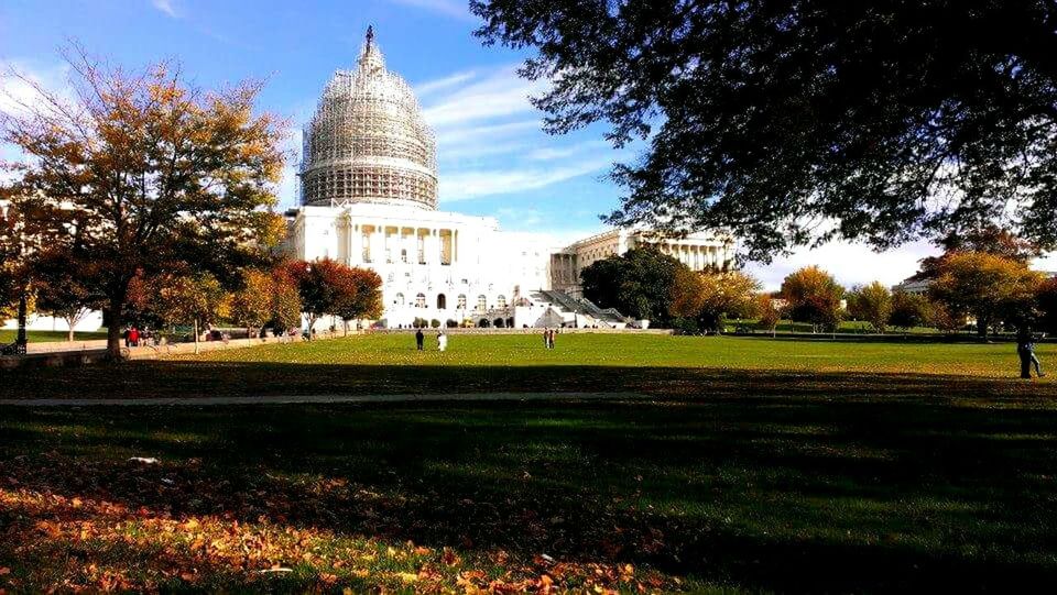 architecture, built structure, building exterior, grass, tree, famous place, lawn, travel destinations, tower, tourism, sky, travel, international landmark, place of worship, dome, park - man made space, capital cities, city, religion, green color