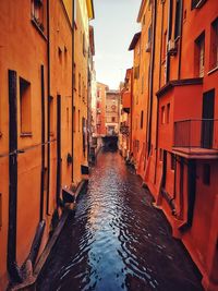 Canal amidst buildings in city
