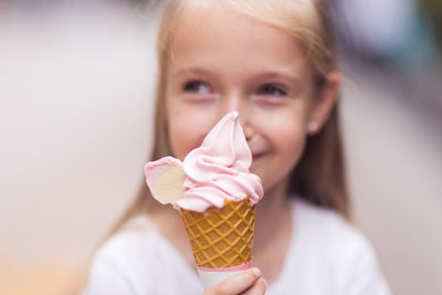 Close-up of young woman holding ice cream cone