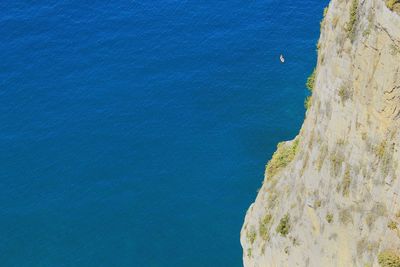 High angle view of rock formation by sea