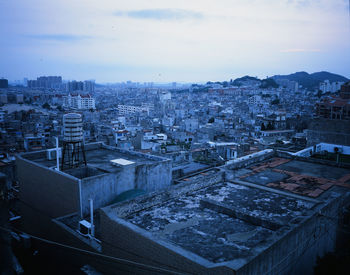 High angle view of buildings in city against sky