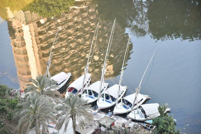 High angle view of sailboats moored in lake