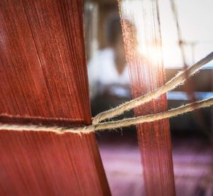 Close-up of rope tied on wood