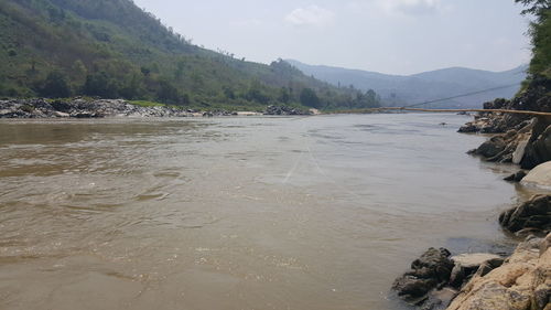 Scenic view of river against sky