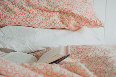 Book on bed at home