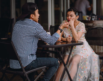 Couple sitting at cafe