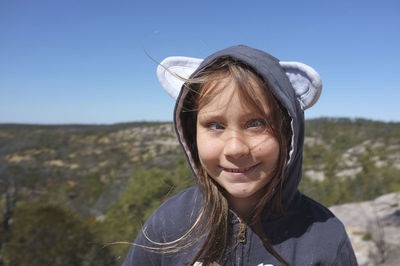 Girl standing in mountains 