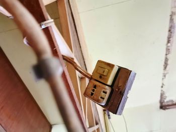 High angle view of door handle on wooden wall