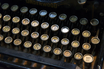 Close-up of old typewriter on table