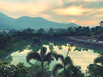 Scenic view of lake against sky during sunset