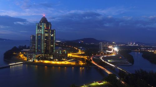 Illuminated buildings in city at night