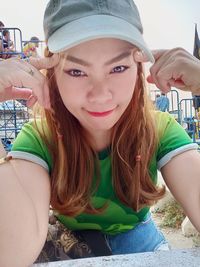 Portrait of young woman wearing hat